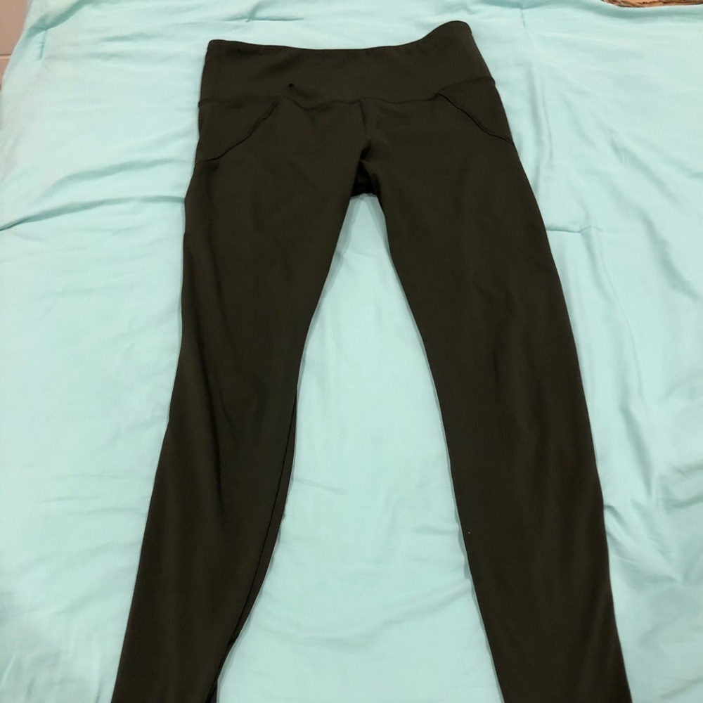High-waisted olive green leggings worn twice